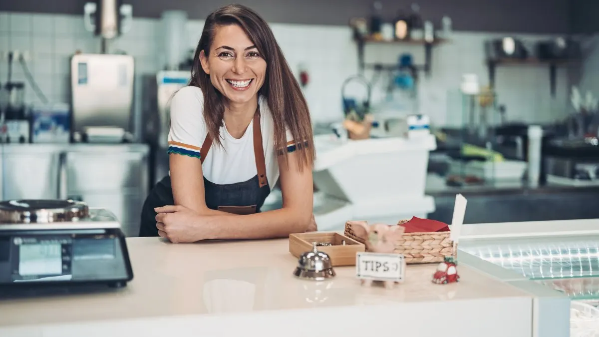 Family restaurant owner behind the counter
